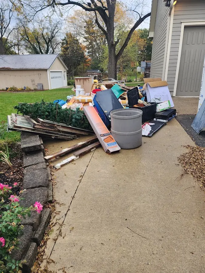 Dumpster being loaded with debris for 3 Yard Dumpster Rental in El Centro